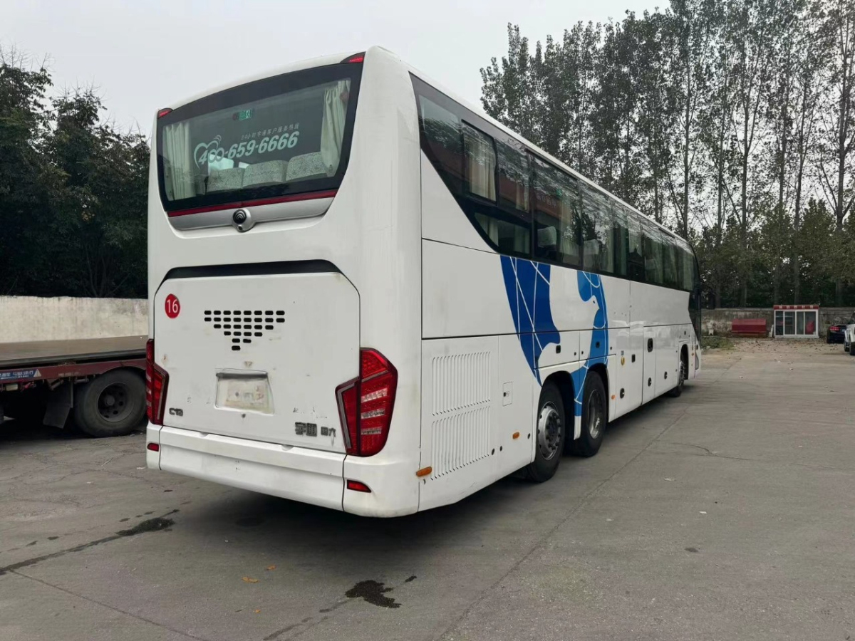 國六56座后吊輪新款宇通C13氣囊旅游車圖片